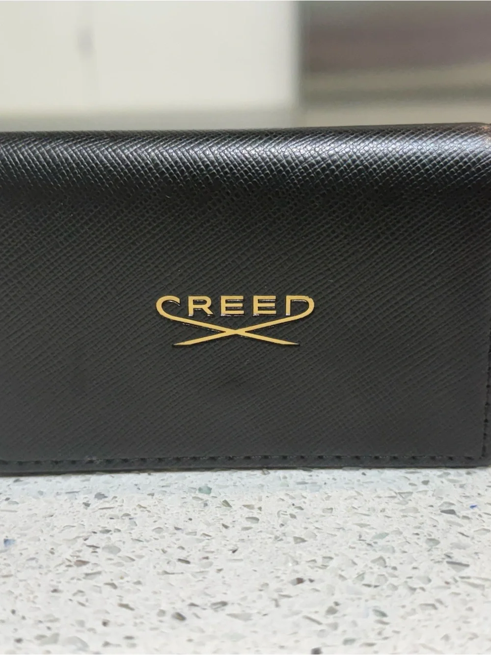 Creed Black Leather Card Case with Gold Emblem